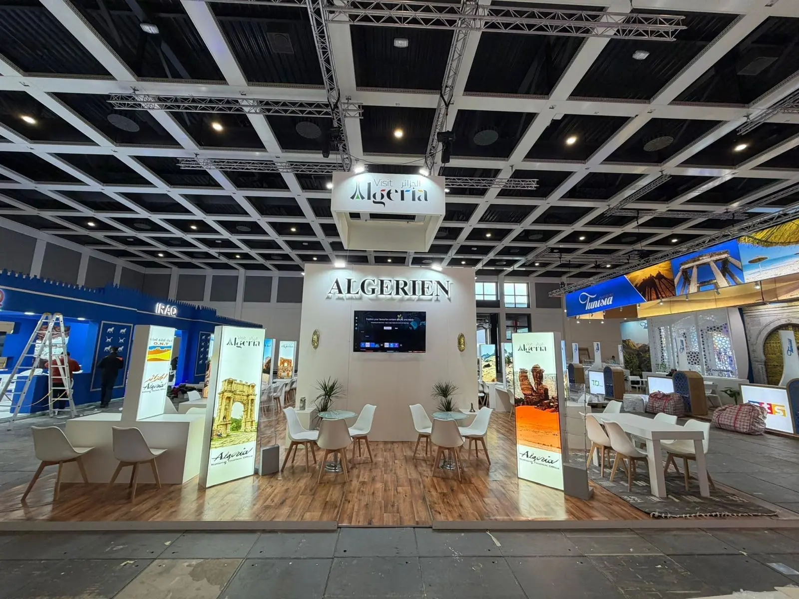 A stylish exhibition booth showcasing modern Scandinavian furniture and decor elements.