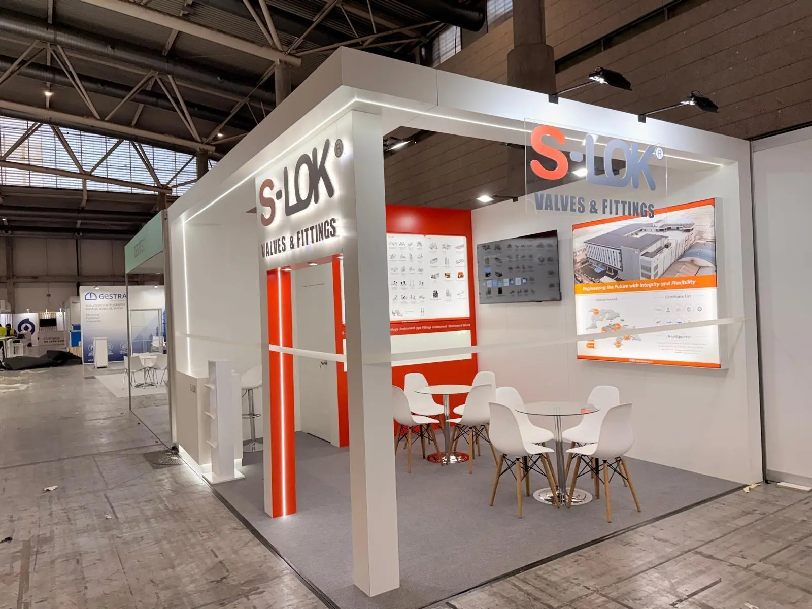 A stylish exhibition booth showcasing modern Scandinavian furniture and decor elements.