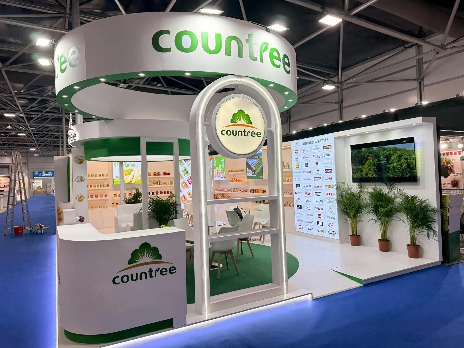 A stylish exhibition booth showcasing modern Scandinavian furniture and decor elements.