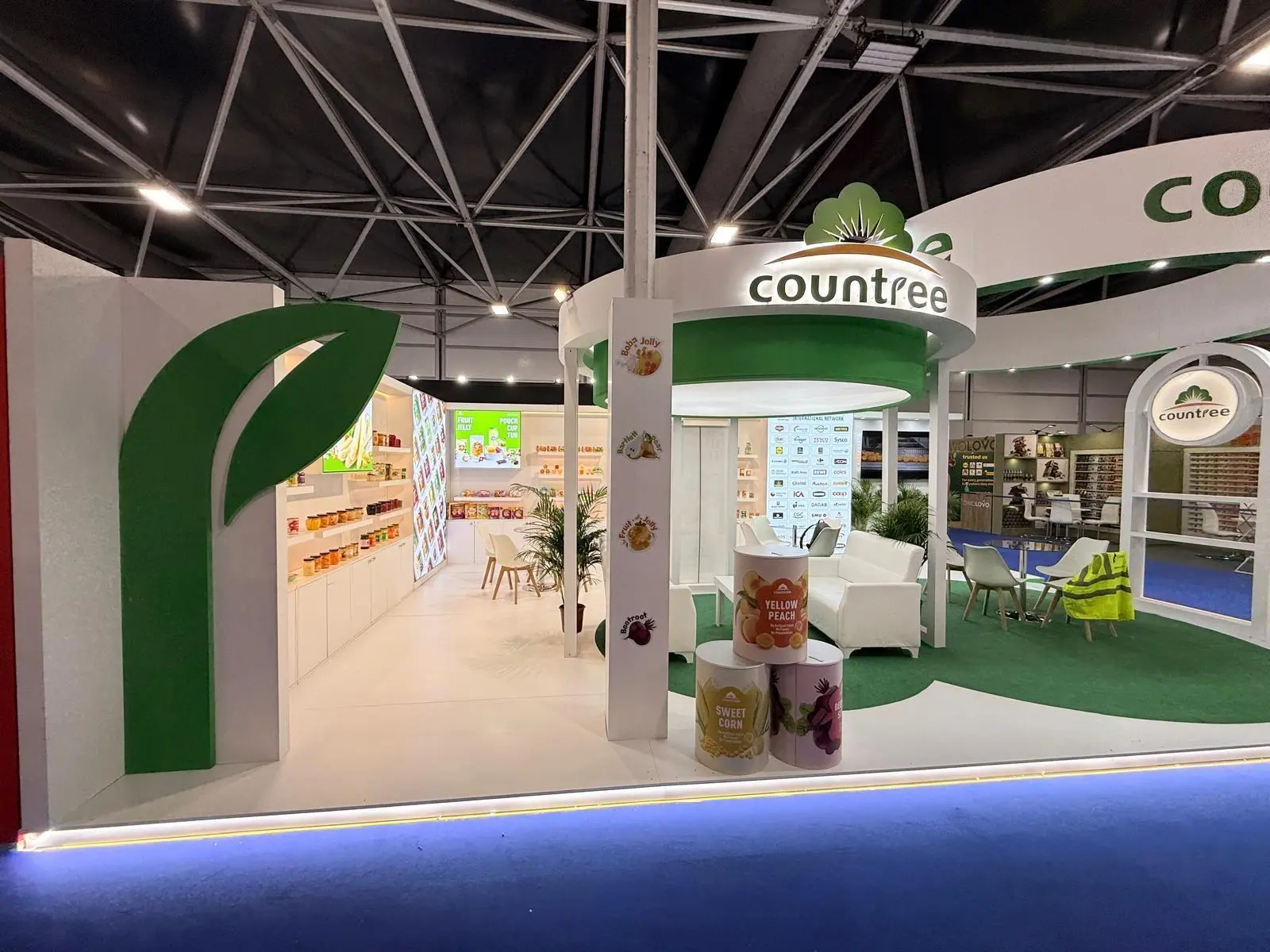 A stylish exhibition booth showcasing modern Scandinavian furniture and decor elements.