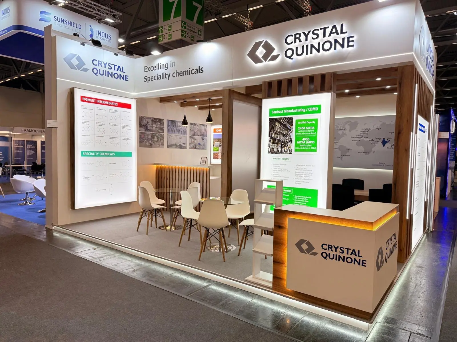 A stylish exhibition booth showcasing modern Scandinavian furniture and decor elements.