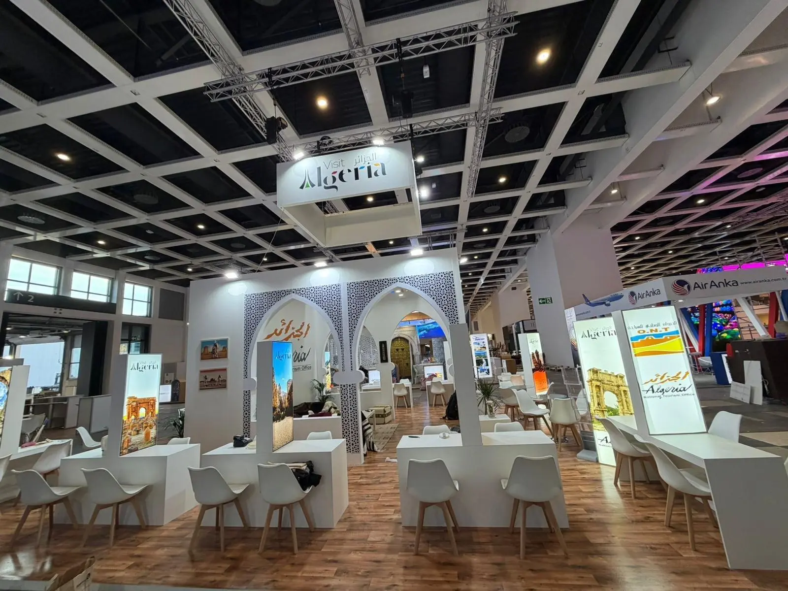 A stylish exhibition booth showcasing modern Scandinavian furniture and decor elements.