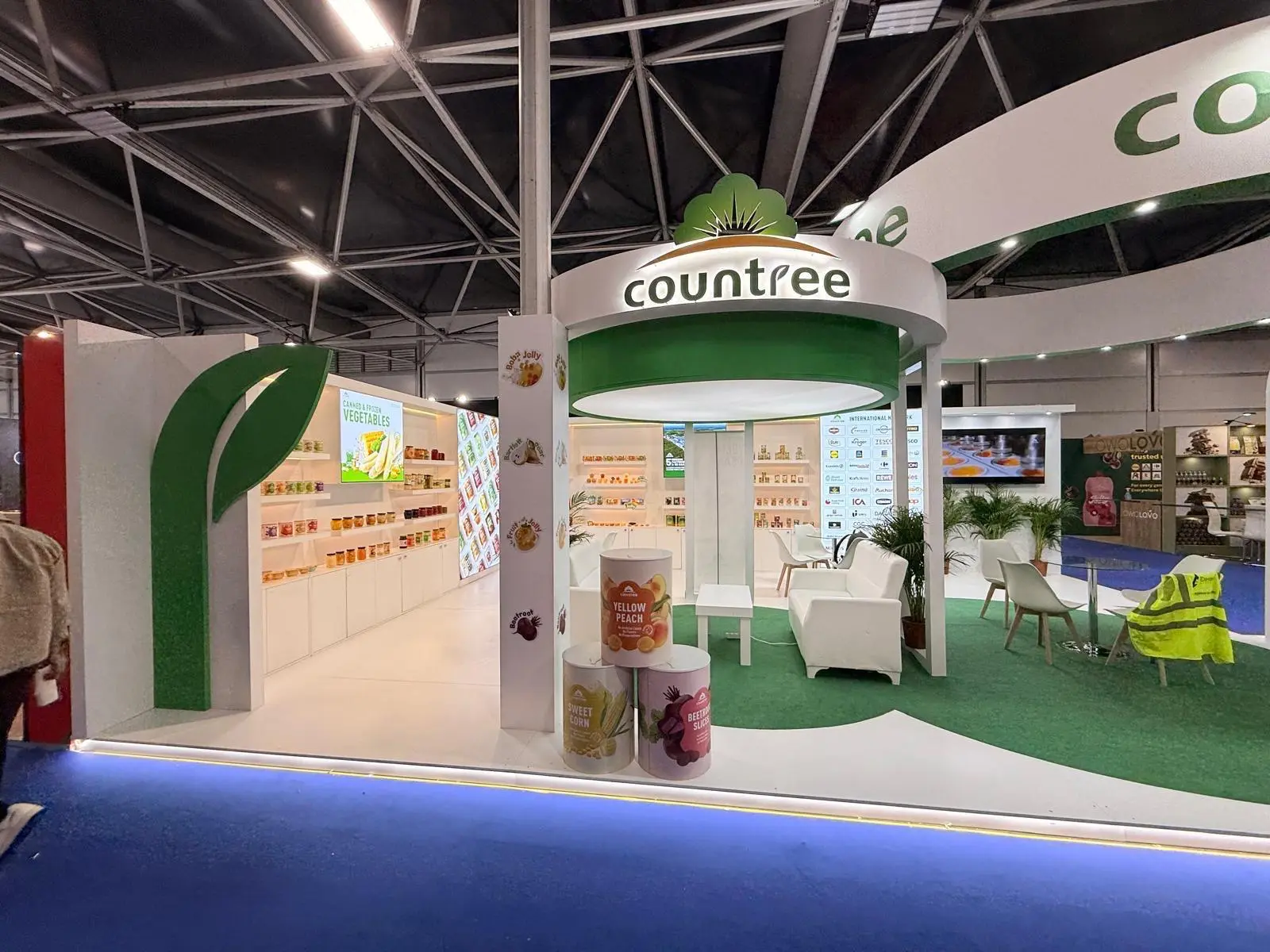 A stylish exhibition booth showcasing modern Scandinavian furniture and decor elements.