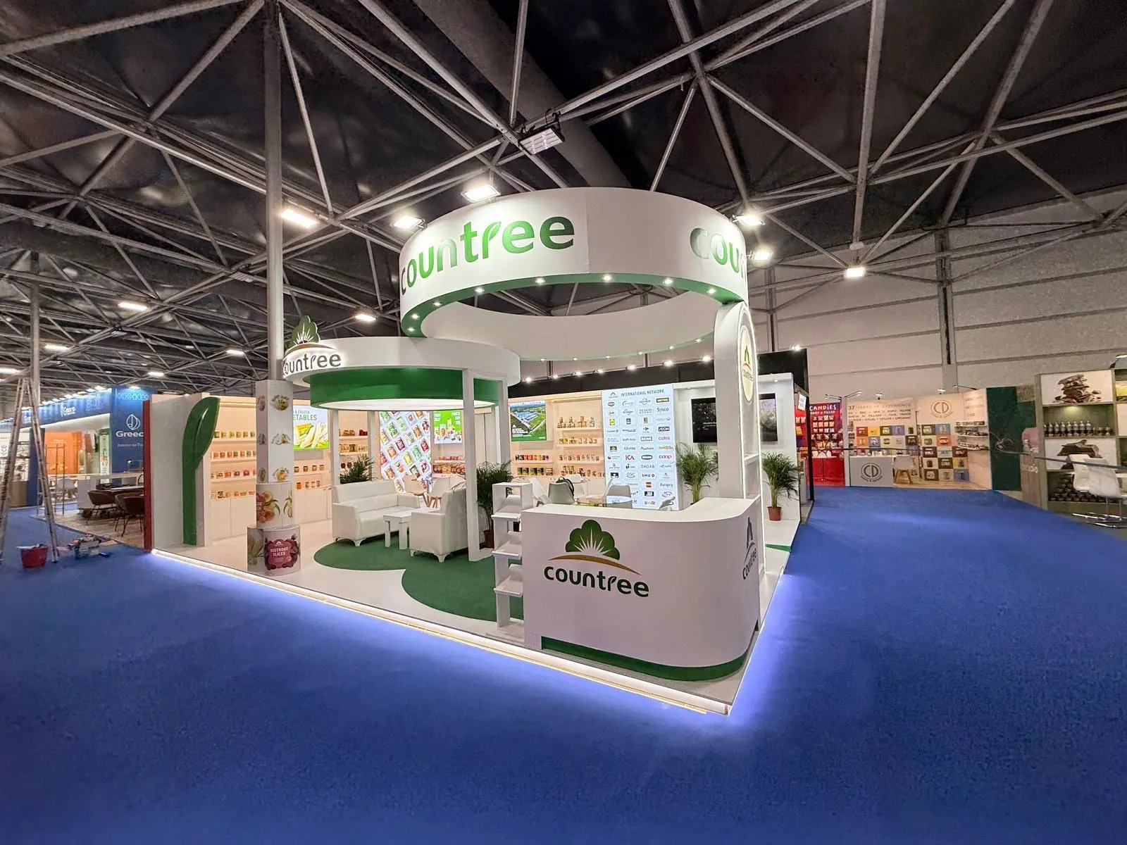 A stylish exhibition booth showcasing modern Scandinavian furniture and decor elements.