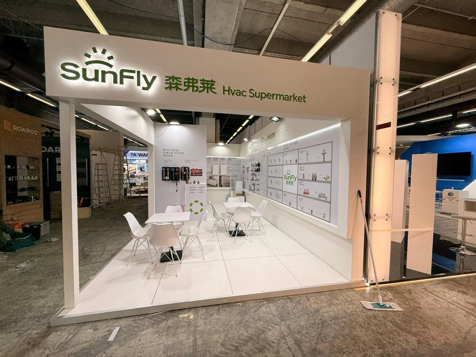 A stylish exhibition booth showcasing modern Scandinavian furniture and decor elements.