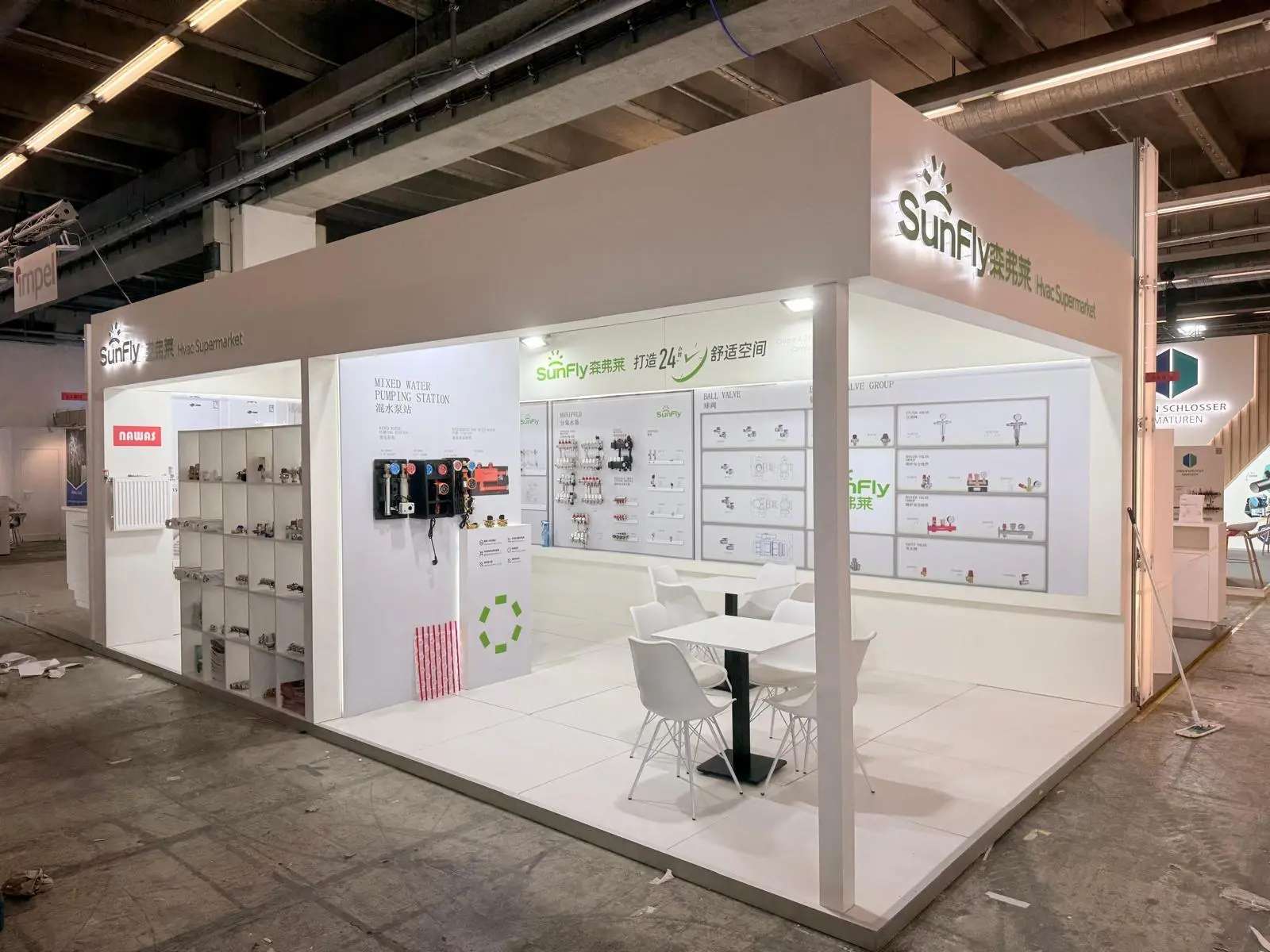 A stylish exhibition booth showcasing modern Scandinavian furniture and decor elements.