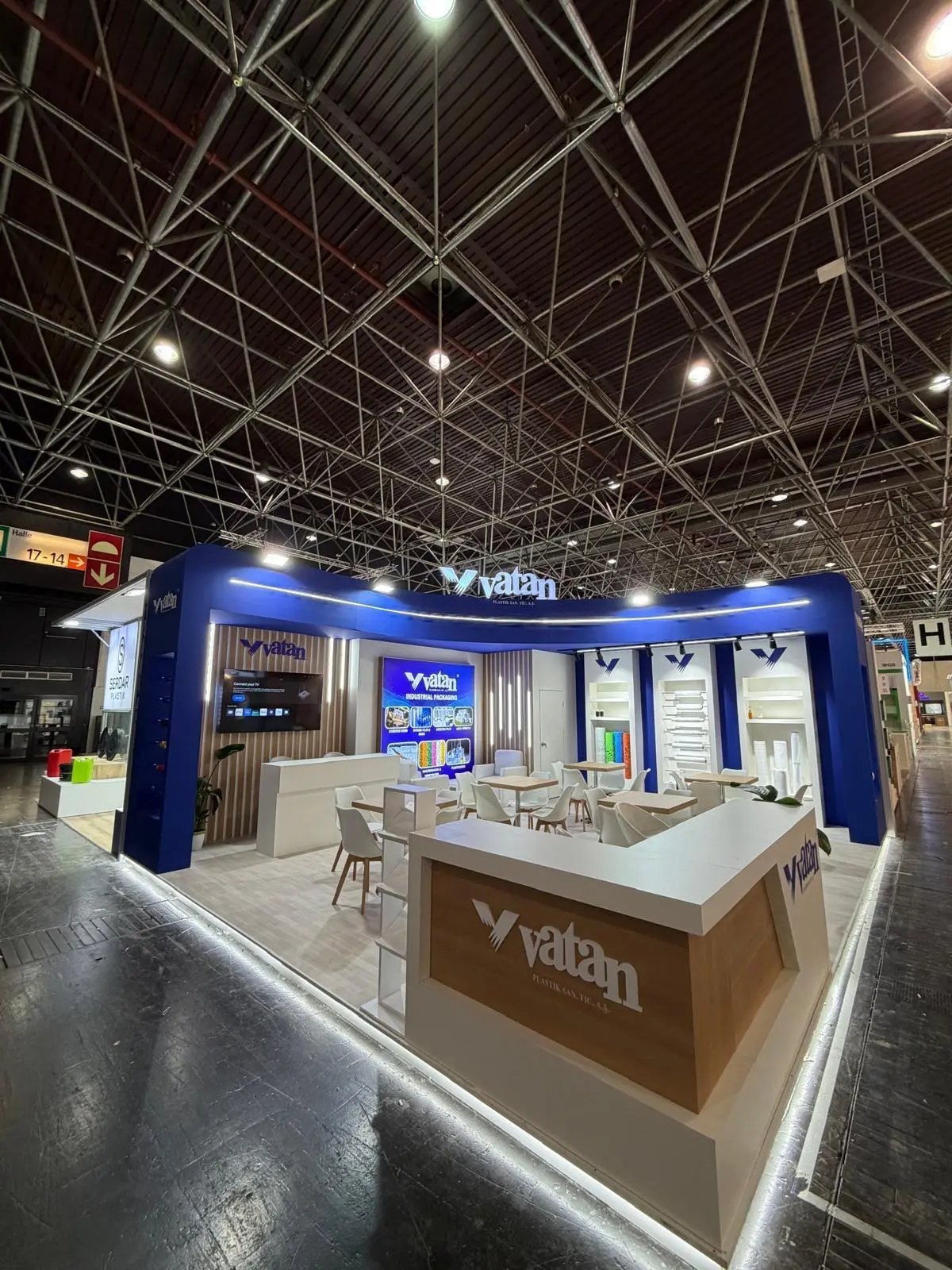 A stylish exhibition booth showcasing modern Scandinavian furniture and decor elements.