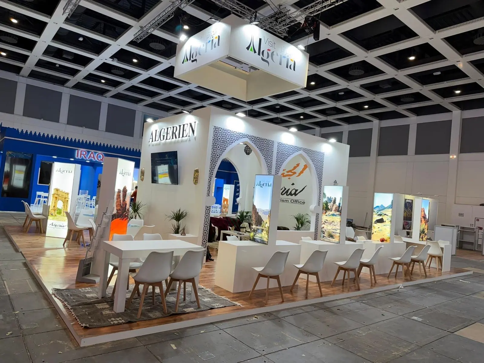A stylish exhibition booth showcasing modern Scandinavian furniture and decor elements.