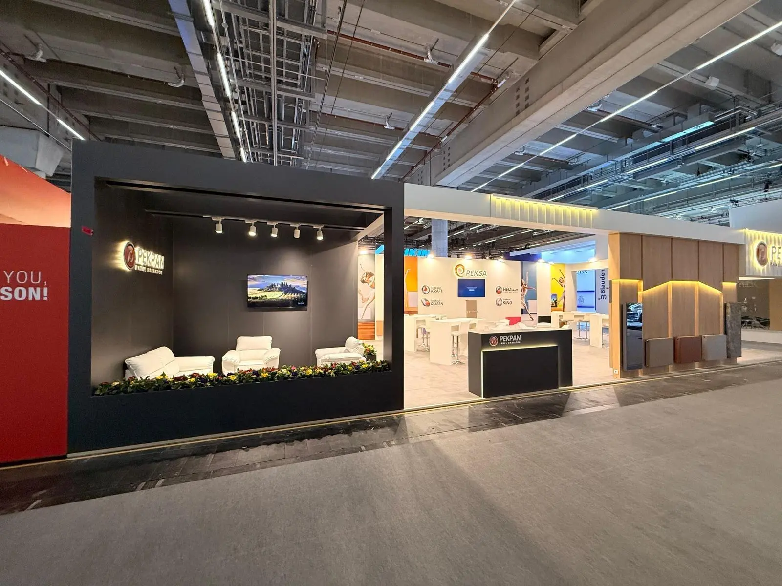A stylish exhibition booth showcasing modern Scandinavian furniture and decor elements.