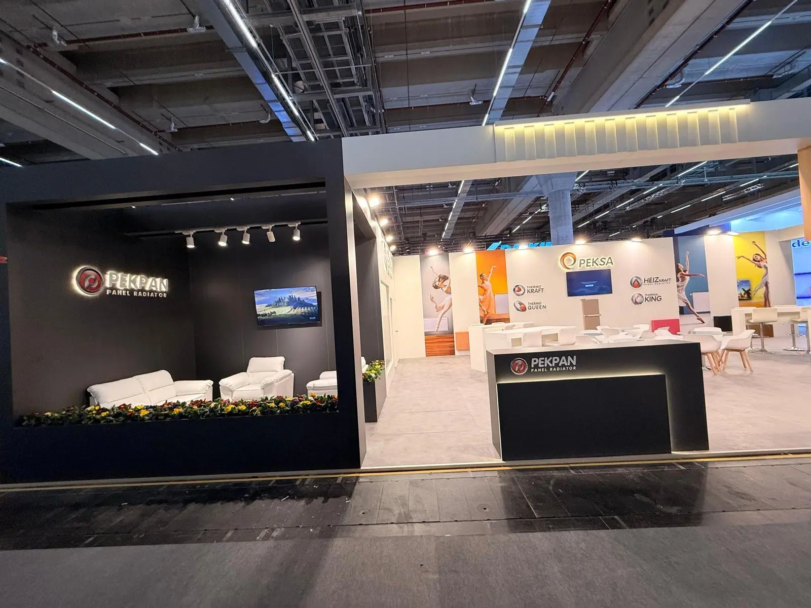 A stylish exhibition booth showcasing modern Scandinavian furniture and decor elements.