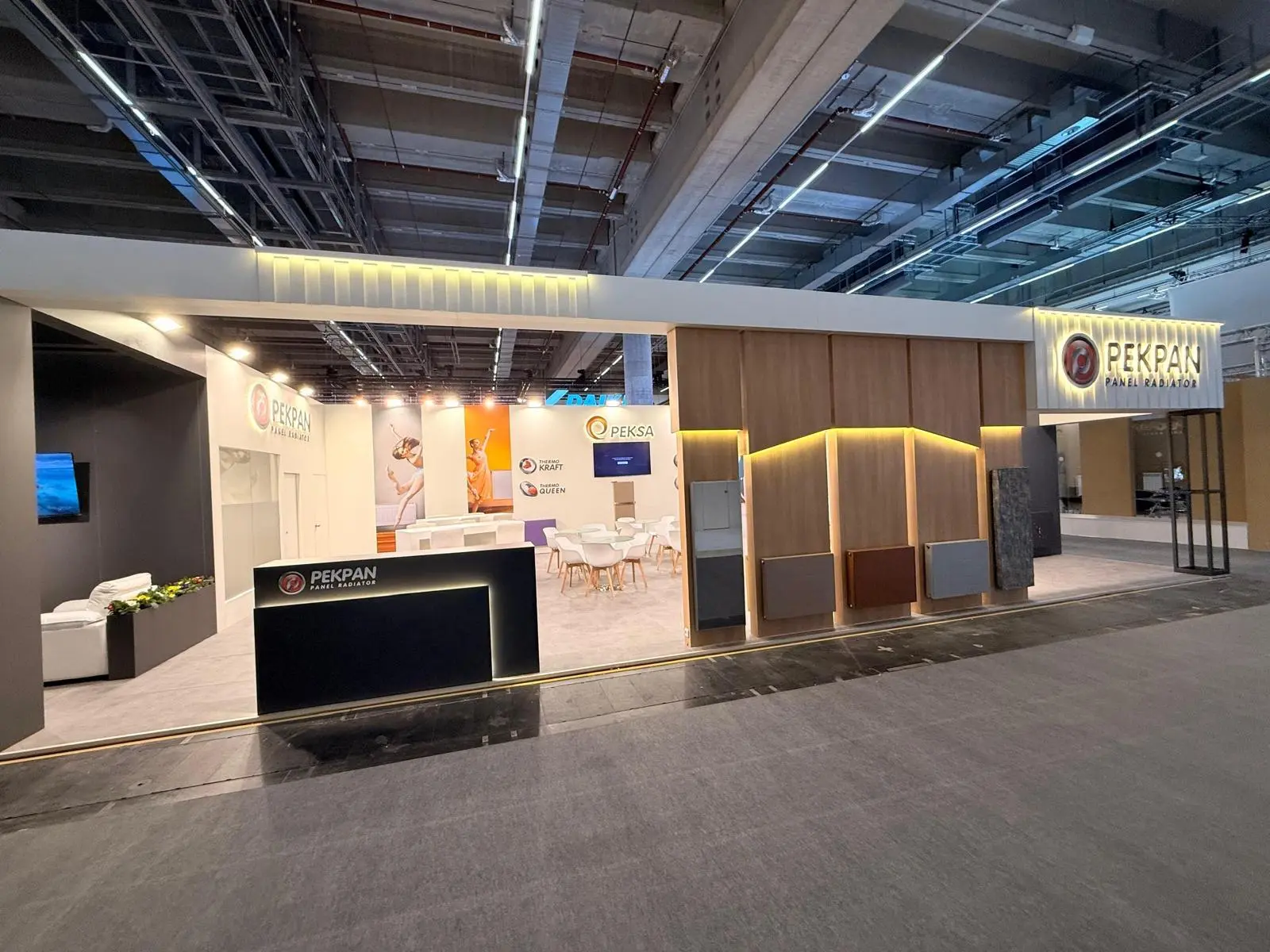A stylish exhibition booth showcasing modern Scandinavian furniture and decor elements.