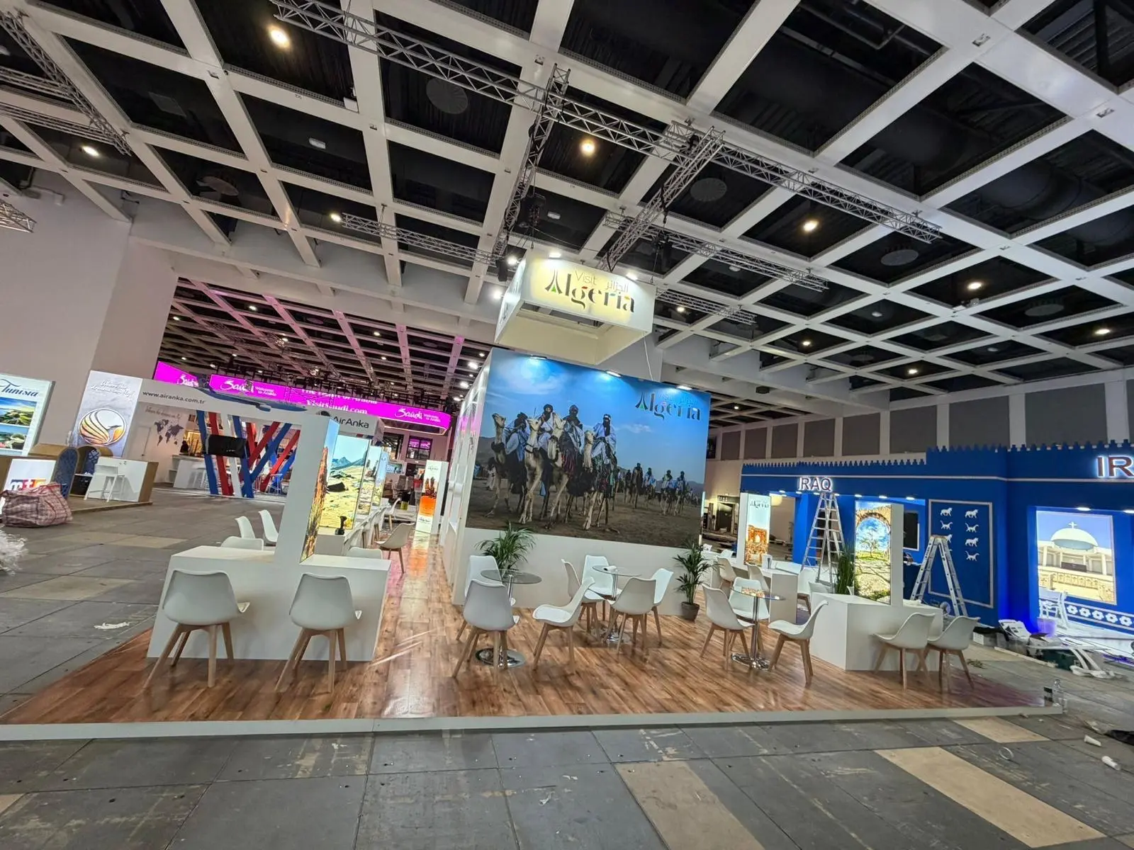 A stylish exhibition booth showcasing modern Scandinavian furniture and decor elements.