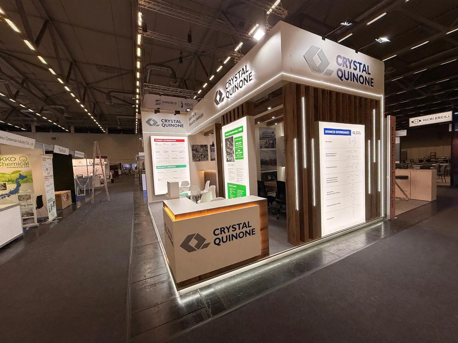 A stylish exhibition booth showcasing modern Scandinavian furniture and decor elements.