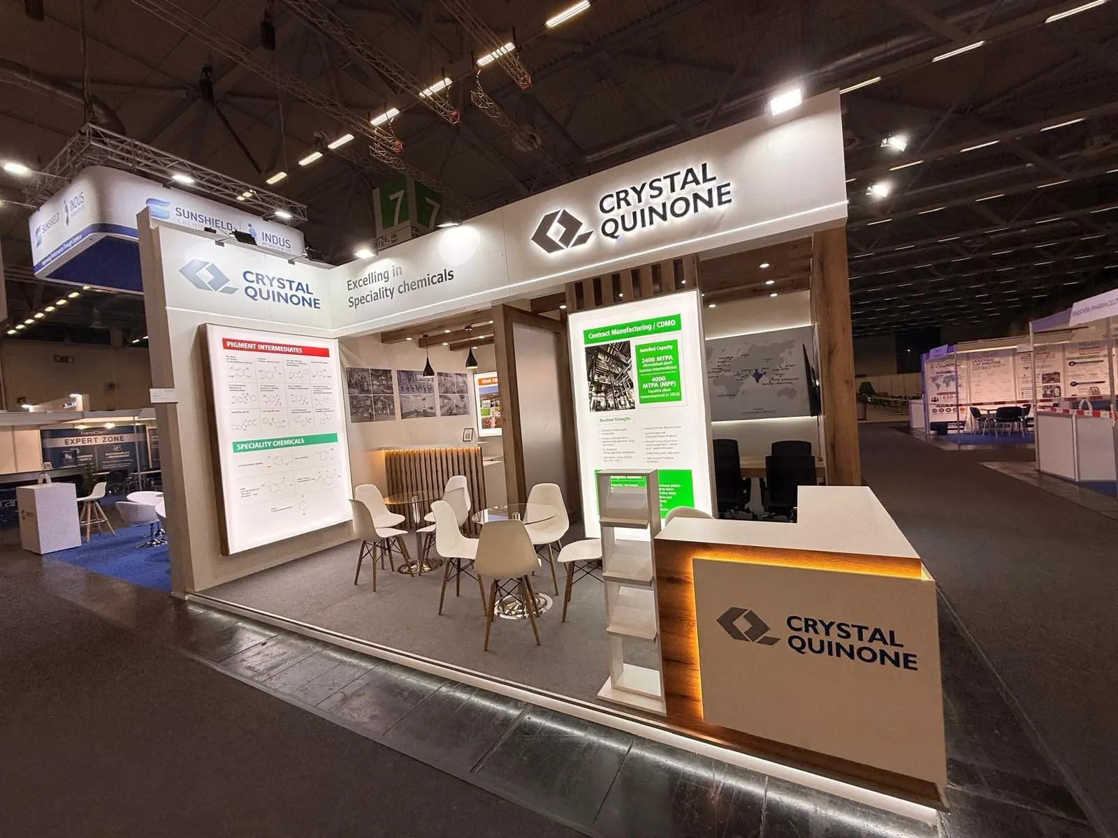 A stylish exhibition booth showcasing modern Scandinavian furniture and decor elements.