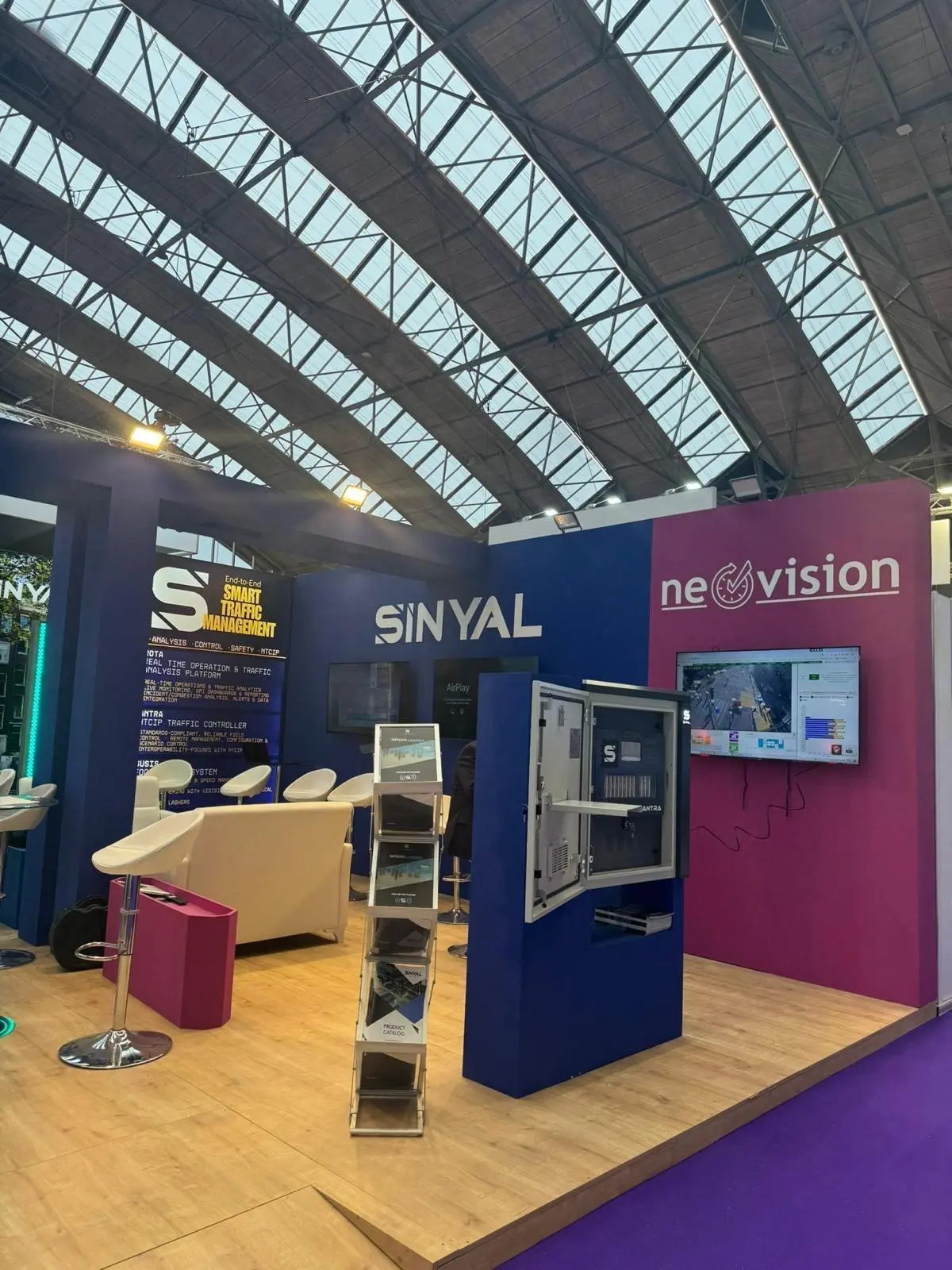 A stylish exhibition booth showcasing modern Scandinavian furniture and decor elements.