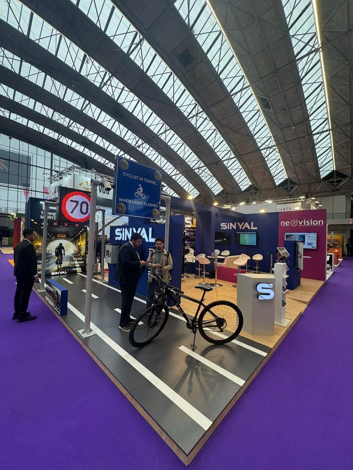 A stylish exhibition booth showcasing modern Scandinavian furniture and decor elements.